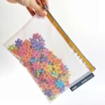 imagen de piezas meli guardadas en la Bolsa transparente porta todo para organizar juguetes A5