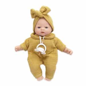 Muñeca Bobble mostaza de 26 cm con el chupete colgando