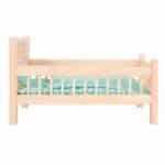 imagen del lateral de la Cuna de madera con ropa de cama para muñecas de Legler