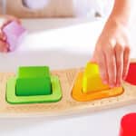 imagen de parte del Puzzle de clasificación de colores y formas de Hape