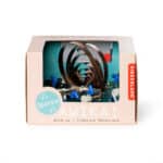 imagen del packaging del Robot de cuerda Awika Criatura Mecánica de Kikkerland