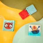 imagen del Set de 3 libros sensoriales de Lilliputiens sobre una alfombra